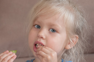 Portrait of a little girl with blue eyes and blond hair