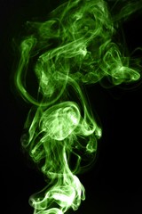 Green smoke on black background