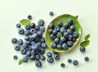 blueberries on green paper background