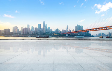 Empty floor with modern skyline and buildings