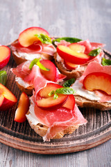 Plum, prosciutto and ricotta bruschetta