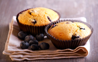 Obraz na płótnie Canvas Blueberry muffins on napkin