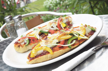 Pizza sliced on white plate