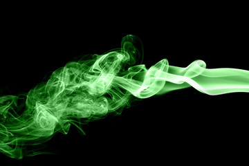 Green smoke on black background