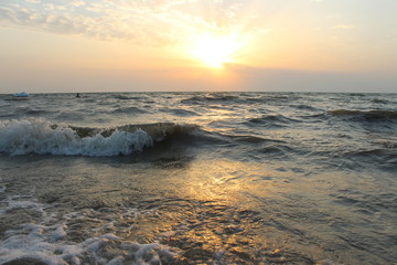 Fototapeta na wymiar Sea and waves at sunset 