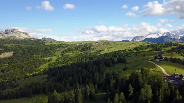 Fantastic landscape on the Dolomites. Drone aerial view on the peaks called Marmolada, Sas Crusc, Lavarela, Conturines, Pizes de Fanis and Lagazuoi. Place is Alta Badia, Sud Tirol, Italy