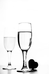 monochrome photo of champagne on white table on white background isolate