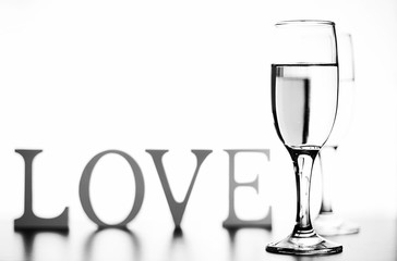 monochrome photo of champagne on white table on white background isolate