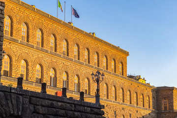 Golden sunlight hit the facade of Palazzo Pitti (Pitti Palace) in Florence