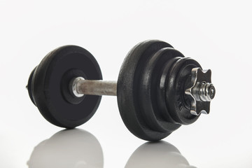 Dumbbell isolated on white background, selective focus