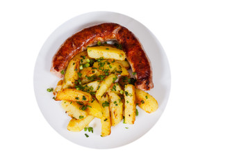 grilled meat sausages with fried potatoes in a plate. top view. isolated on white