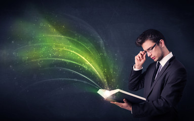 Young man holding book with wave