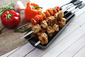 Kebab cooked on metal skewers with vegetables