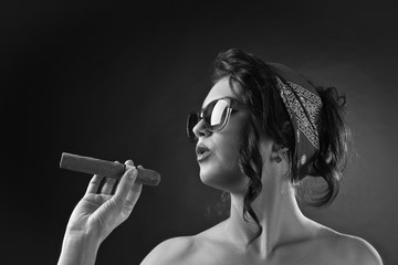 young beautiful woman with cigar