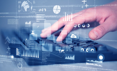 Keyboard buttons pressed by hand with high tech icons