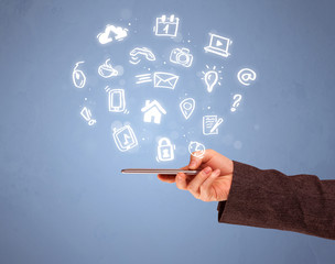 Hand holding tablet phone with drawn icons