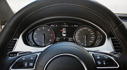 Car dashboard, illuminated panel, speed display