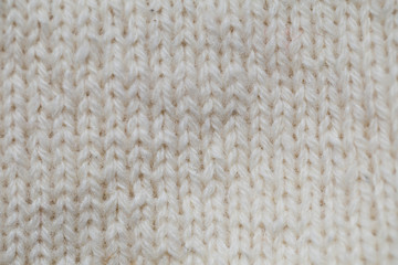 A beautiful closeup of a hand knitted warm and soft wool pattern. Soft socks or scarf of natural wool. Colorful pattern.