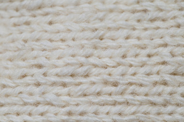 A beautiful closeup of a hand knitted warm and soft wool pattern. Soft socks or scarf of natural wool. Colorful pattern.