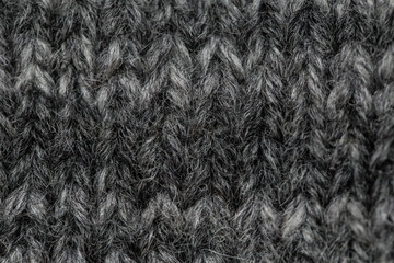 A beautiful closeup of a hand knitted warm and soft wool pattern. Soft socks or scarf of natural wool. Colorful pattern.