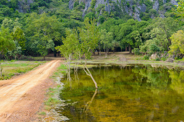 Fototapeta na wymiar The dirt road to Khao Dang Viewpoint, Sam Roi Yod National park, Phra Chaup Khi Ri Khun Province in Middle of Thailand.