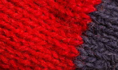 A beautiful closeup of a hand knitted warm and soft wool pattern. Soft socks or scarf of natural wool. Colorful pattern.