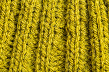 A beautiful closeup of a hand knitted warm and soft wool pattern. Soft socks or scarf of natural wool. Colorful pattern.
