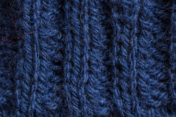 A beautiful closeup of a hand knitted warm and soft wool pattern. Soft socks or scarf of natural wool. Colorful pattern.