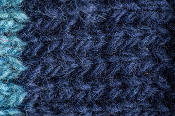 A beautiful closeup of a hand knitted warm and soft wool pattern. Soft socks or scarf of natural wool. Colorful pattern.