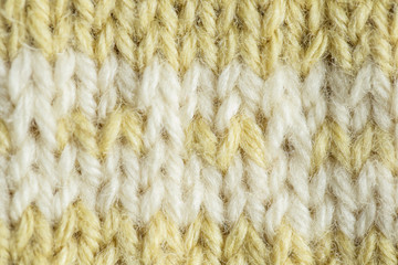 A beautiful closeup of a hand knitted warm and soft wool pattern. Soft socks or scarf of natural wool. Colorful pattern.