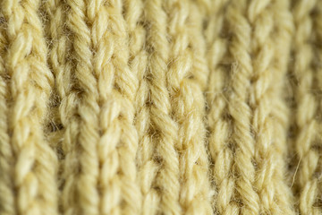 A beautiful closeup of a hand knitted warm and soft wool pattern. Soft socks or scarf of natural wool. Colorful pattern.