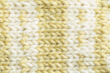 A beautiful closeup of a hand knitted warm and soft wool pattern. Soft socks or scarf of natural wool. Colorful pattern.