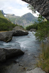 Naklejka na ściany i meble River rapids nearby the Briksdal Glacier (Olden, Norway).