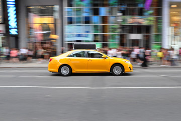 Panning shot of a taxicab at Times Square in New York, USA.