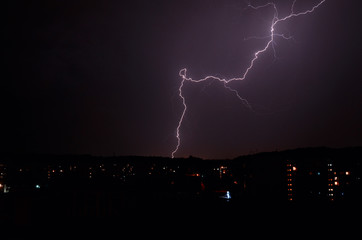Thunderstorm with lightning at night in the city