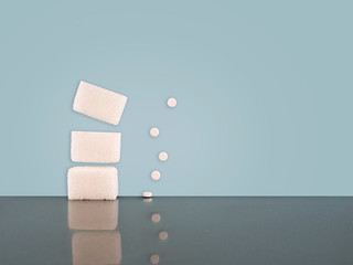 Sugar or artificial sweetener. Both on pale blue background.