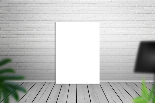 Empty art canvas leaning on brick wall. Isolated for mockup.