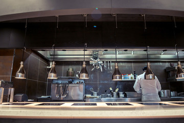 Variety of utensils on counter in commercial kitchen