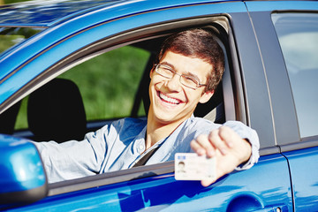 Guy in car with driving license