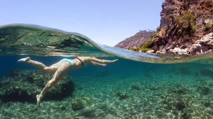 Fototapeta na wymiar woman swims into the sea