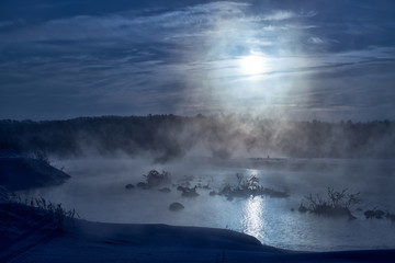 Snags in the river water in  winter Moon night