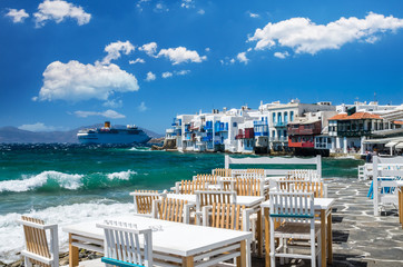 Little Venice, Mykonos island, Greece. Colourful buildings and balconies near the sea and a large...