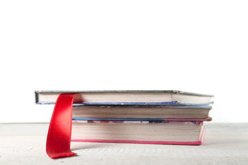 a textbook and a red bookmark isolated on white background, school background