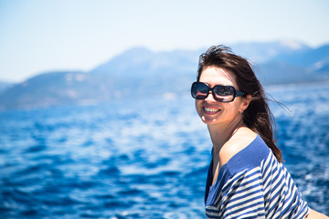 Young beautiful woman on the sea.