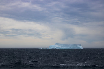 Fototapeta na wymiar Lonely iceberg in ocean