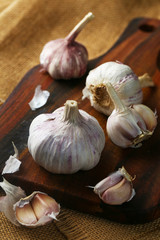 Garlic on vintage wooden board