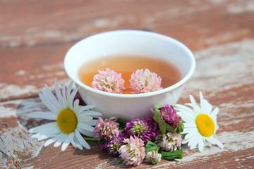 Obraz na płótnie Canvas Herbs tea from curative plants on wooden surface. Herbal Medicine.