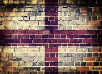 Grunge England flag on a brick wall