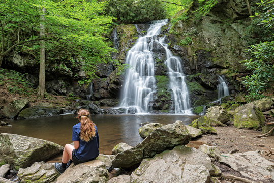 Fototapeta Young Woman Viewing Spruce Flats Falls