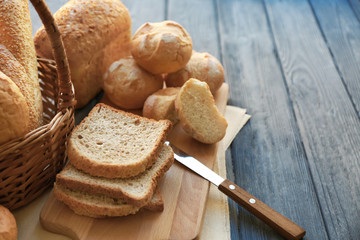 Composition with delicious bread on wooden background